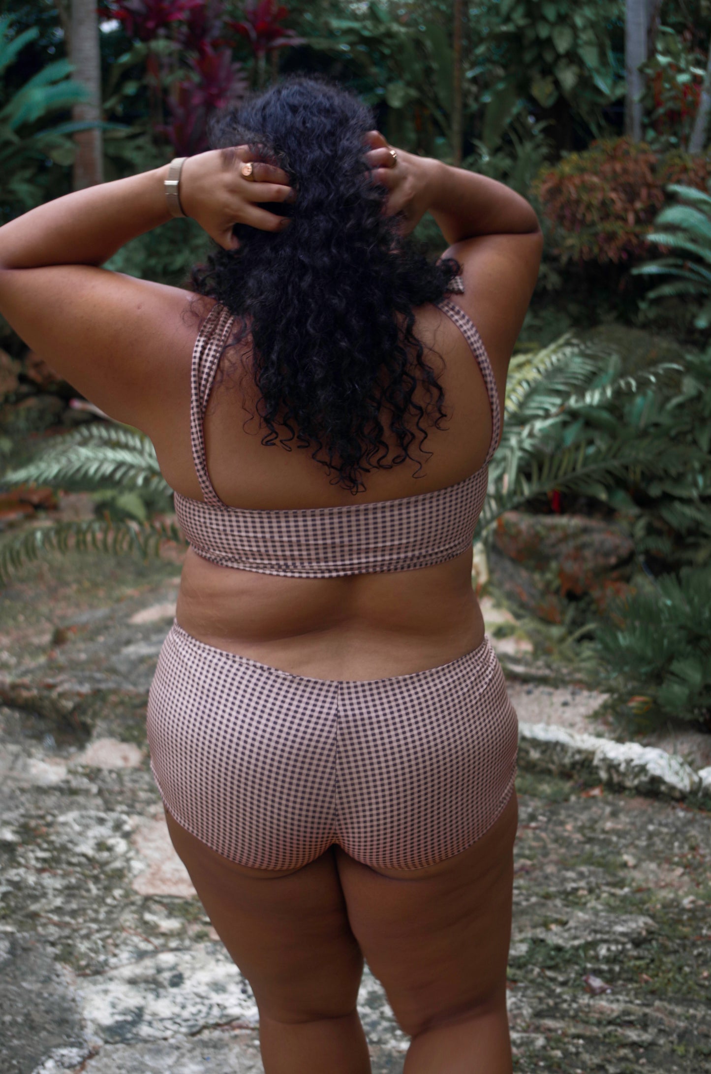 women's plus size full coverage swimsuit. Underwire bikini top and swim shorts in gingham print with neutral colors: black, taupe and cream