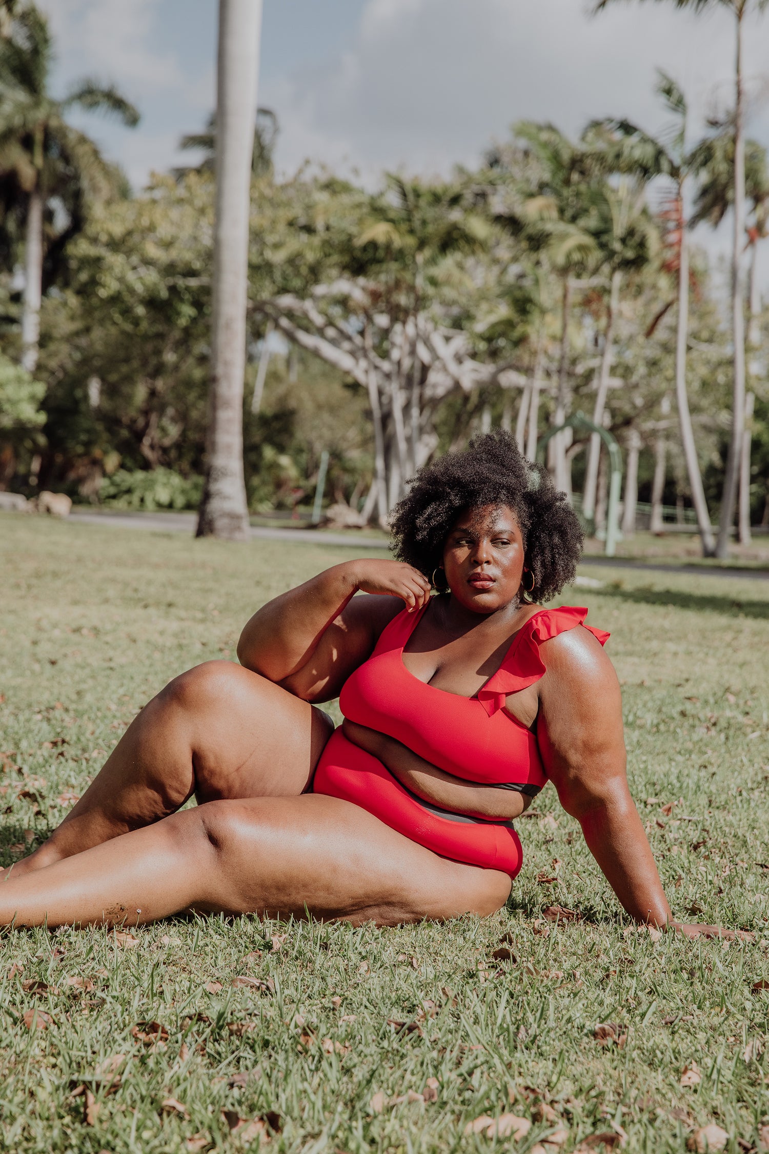 women's red high waisted bikini bottom and asymmetrical bikini top