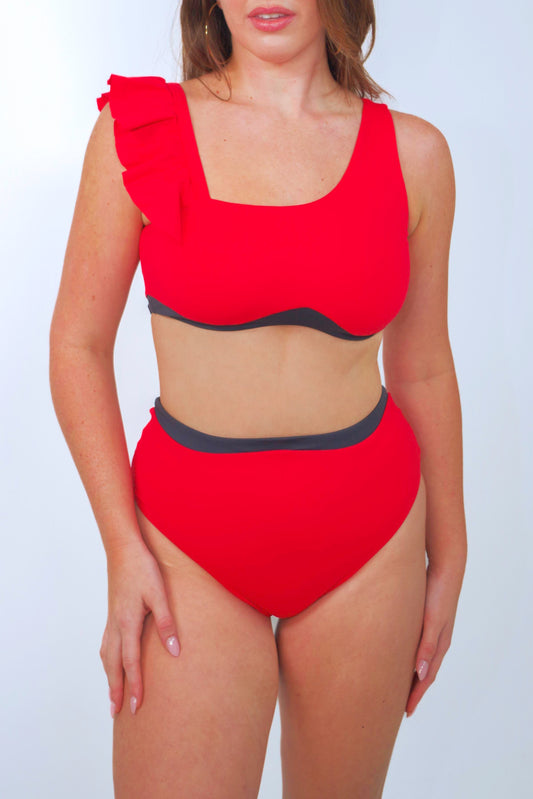 women's red high waisted bikini bottom and asymmetrical bikini top