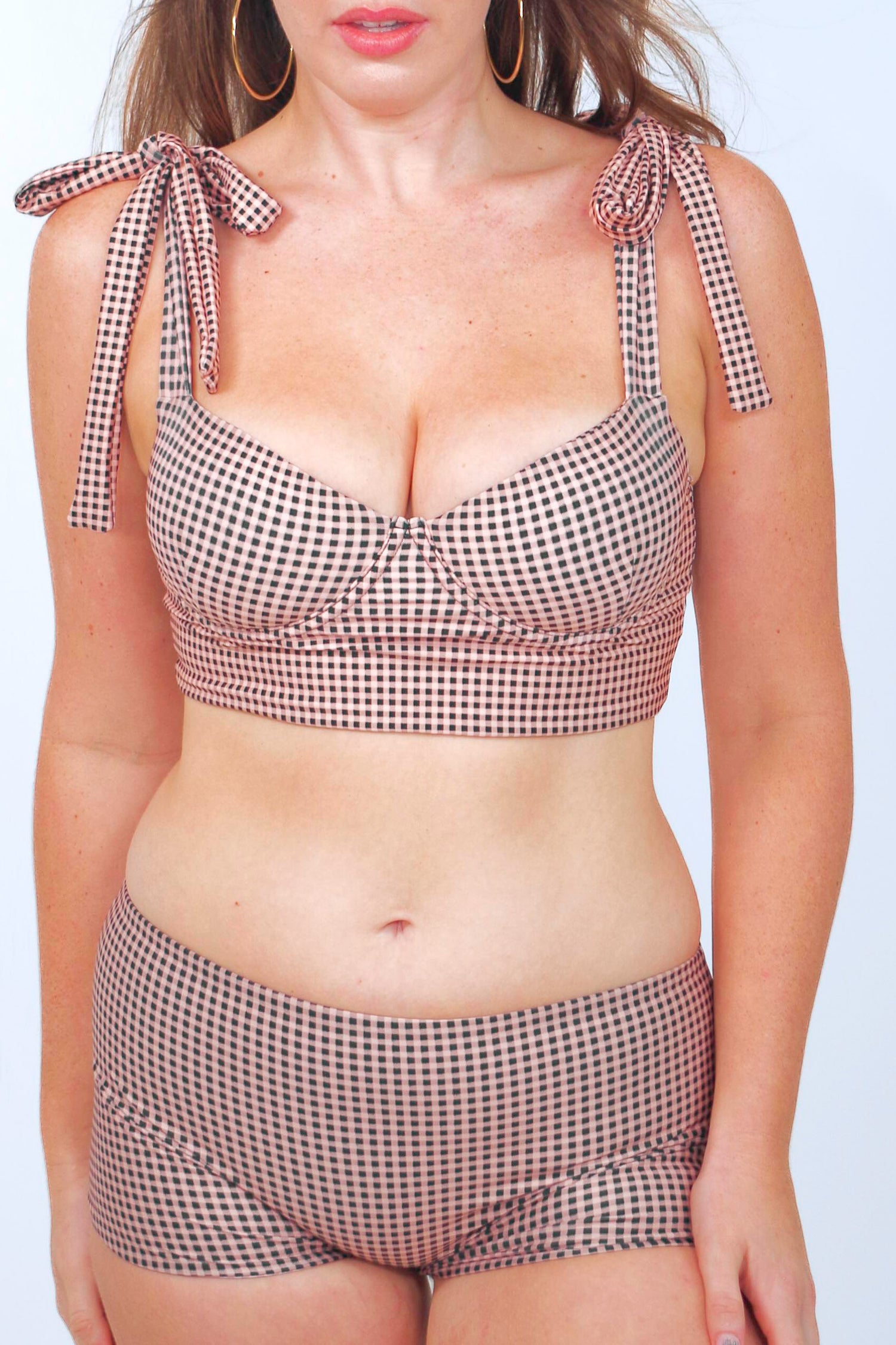 women's full coverage swimsuit. Underwire bikini top and swim shorts in gingham print with neutral colors: black, taupe and cream