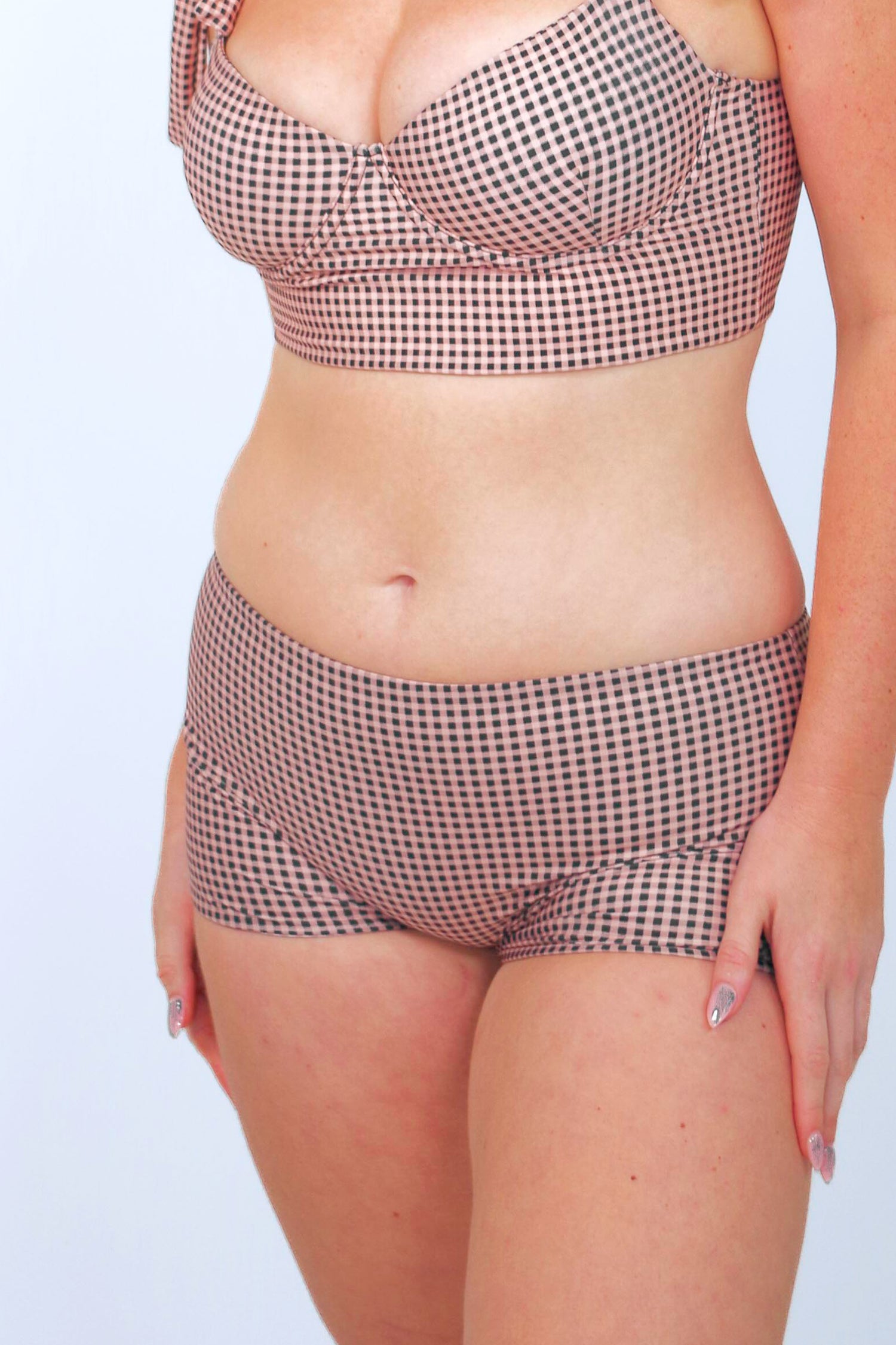 women's full coverage swimsuit. Underwire bikini top and swim shorts in gingham print with neutral colors: black, taupe and cream