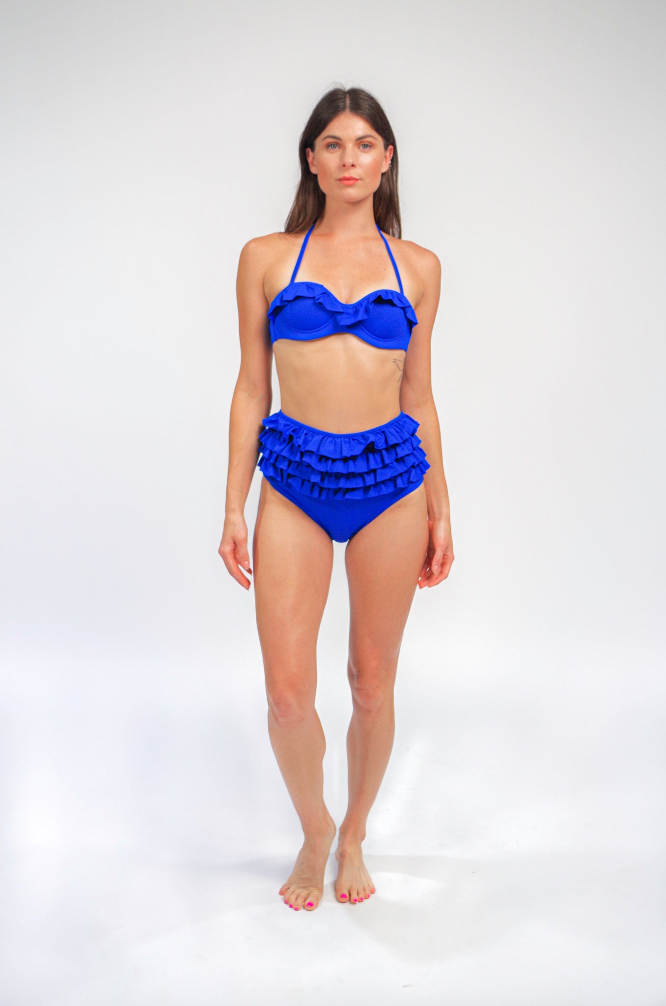 Women's royal blue halter bikini top with built in padding and underwire + high waisted bikini bottom with ruffles.